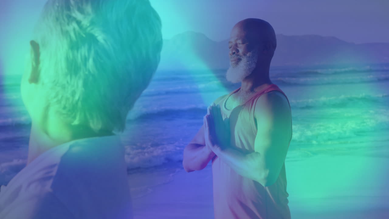 Mature man and woman practicing yoga on beach, showing health app breathing circles and sun icons