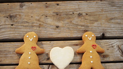 gingerbread cookies arranged on wooden table 4k