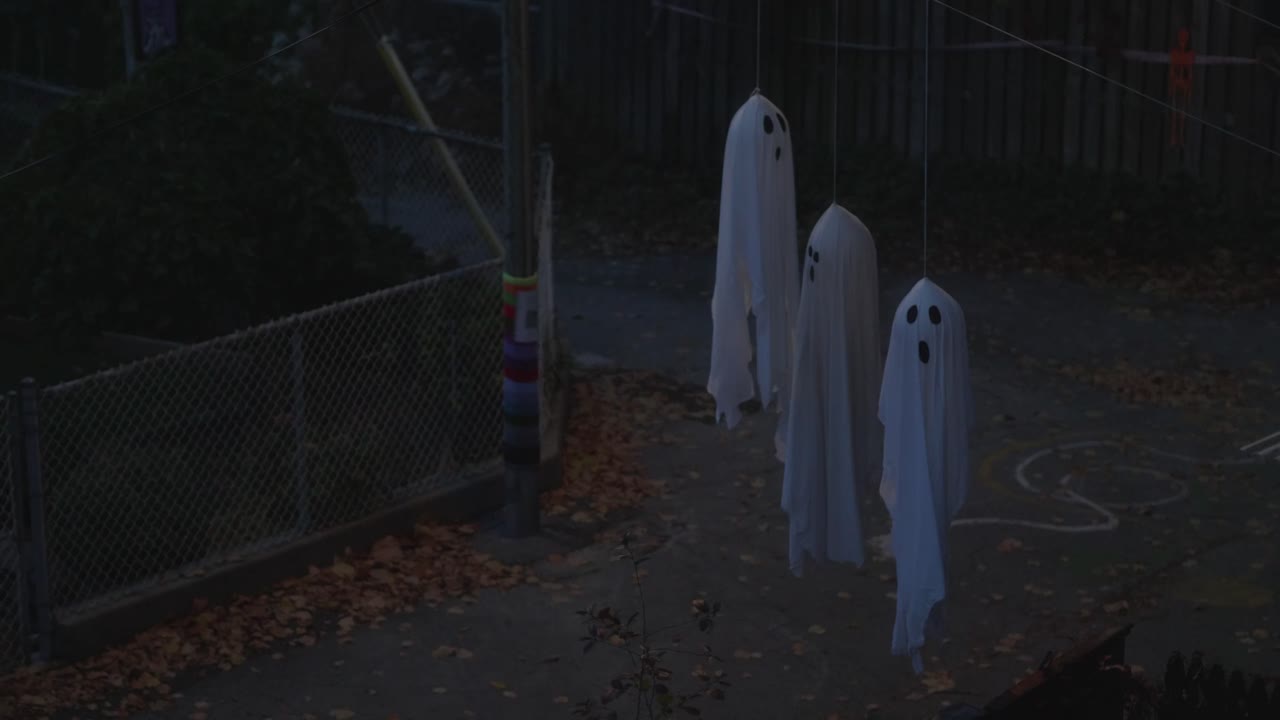 Three Hanging Ghost Decorations Made Of Cloth - Halloween Decorations. - wide shot