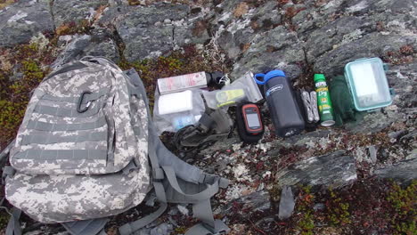 a closeup shot of a backpack and hiking camping survival gear nd supplies as needed on kodiak island alaska