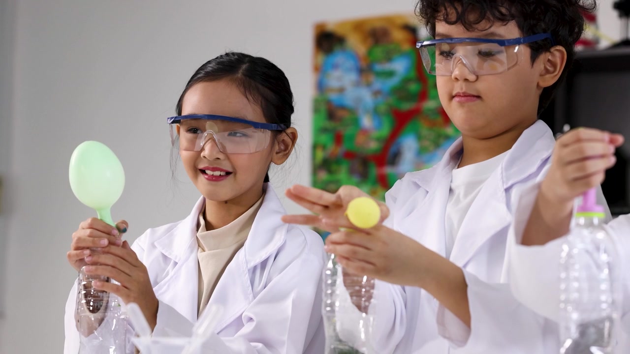 Young Students Conducting Science Experiment with Balloons and Bottles