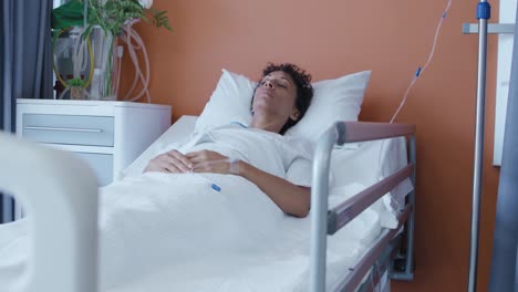 female patient lying in a hospital bed