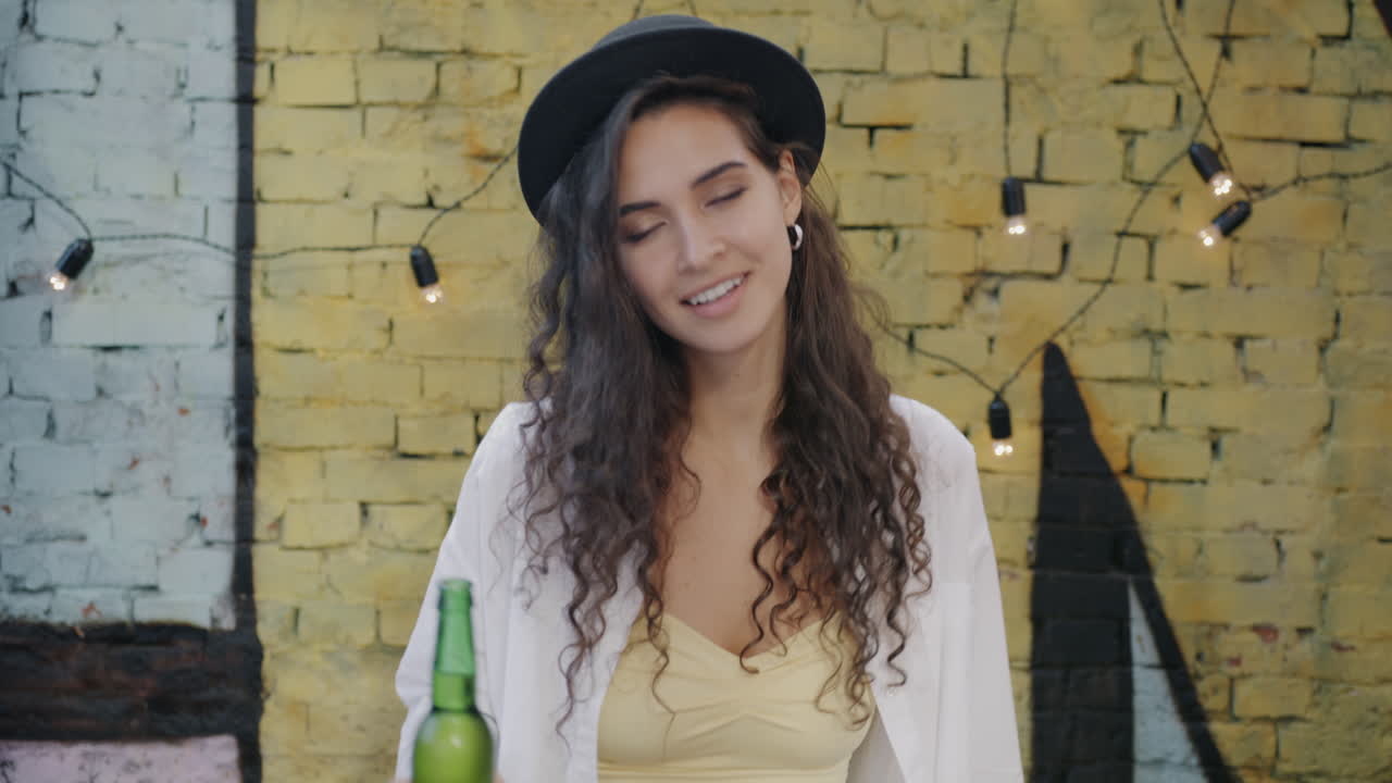 Woman Drinking Beer Outdoors