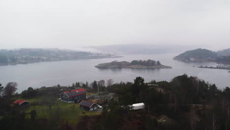 Aerial-Exploration-of-Misty-Orust-Countryside-and-Islands,-Sweden