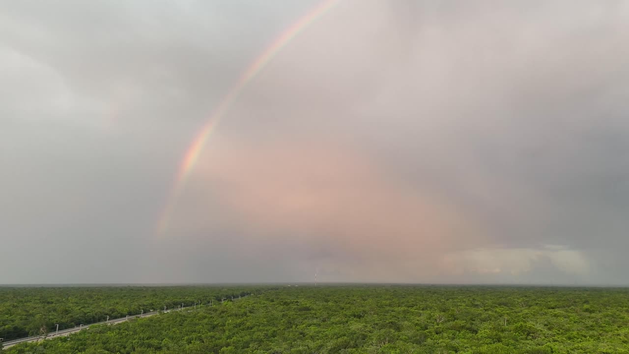 Beautiful rainbow over the dense Yucatan jungle