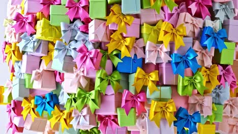 stack of colorful gift boxes with bows