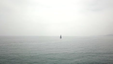 drone shot of sailboat sailing in the ocean
