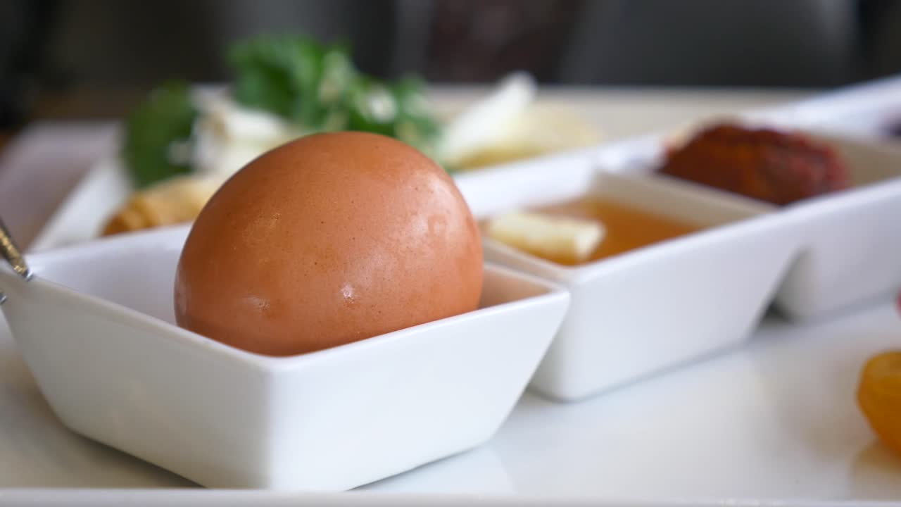 Close-up of an egg in a white bowl