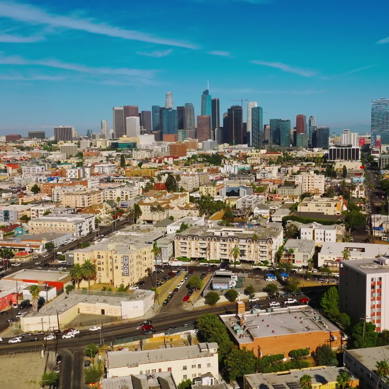 Amazing bright sunny picture of Los Angeles, California, USA. Drone rising over the cityscape. Skyscrapers at backdrop