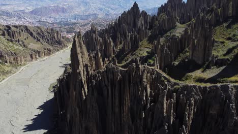 Low-aerial-in-Valle-de-las-Animas-valley-of-steep-rock-formation-spires