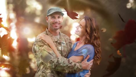 military soldier embracing his wife against autumn leaves 4k