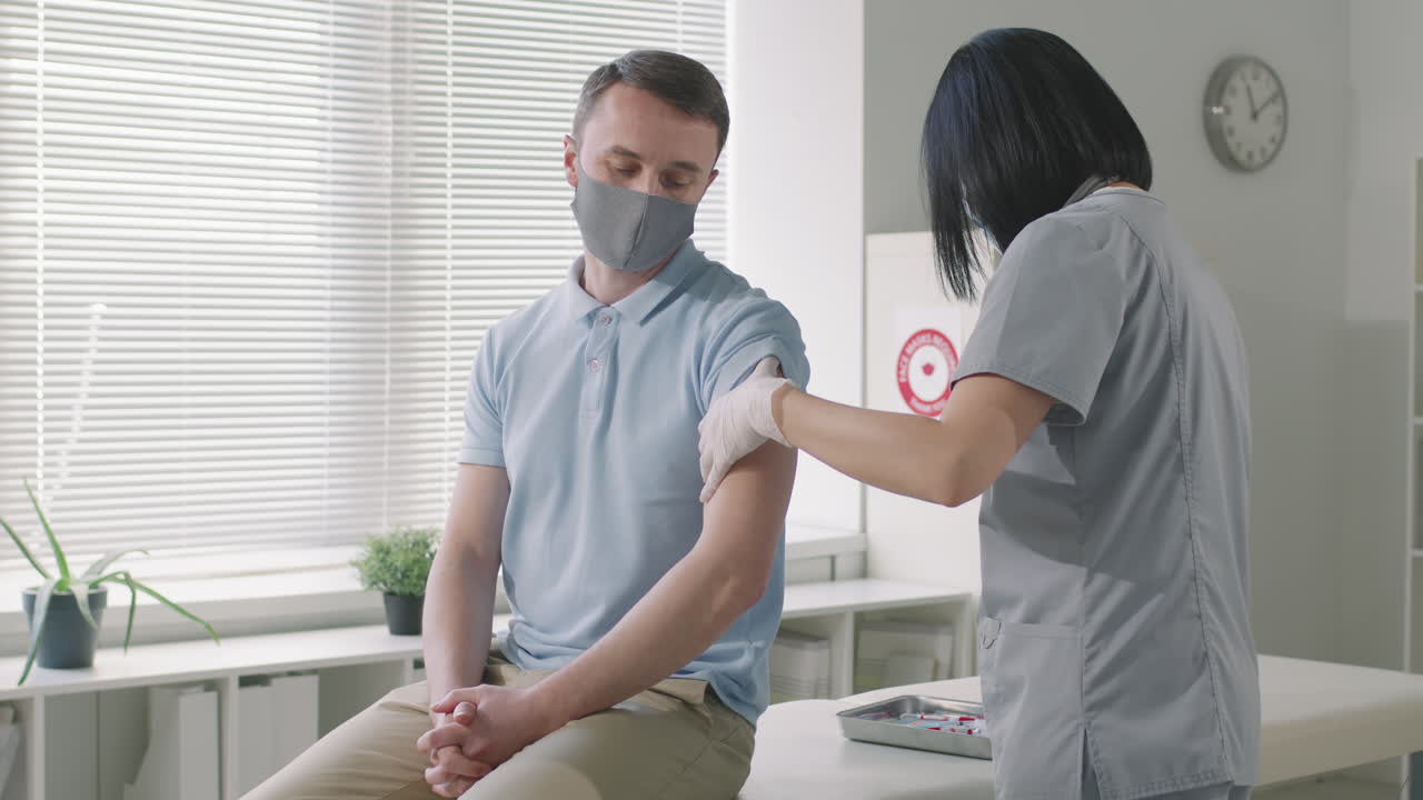 Caucasian Man Gets Vaccinated