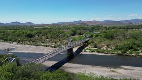 aerial view of choluteca, honduras with iconic suspension bridge and rural landscape