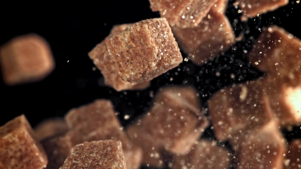 Brown Sugar Cubes Falling in Super Slow Motion with Scattering Particles