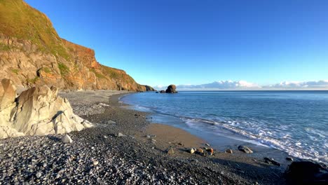 golden cliffs and blue seas full tide at tankardstown beach copper coast waterford ireland