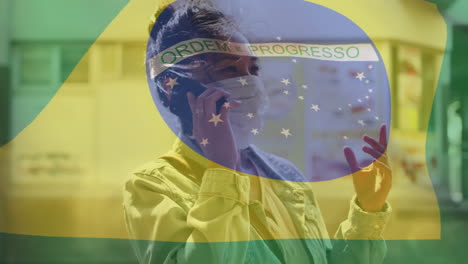 animation of flag of brazil waving over woman in face masks