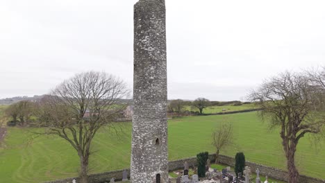 ancient round tower at monasterboice ruins, an early christian site in ireland