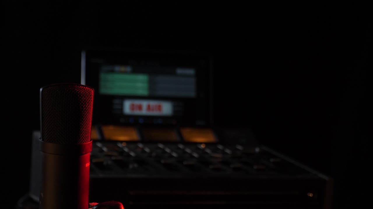 Microphone in the studio on the air with a mixing board
