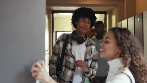 University,-lockers-and-friends-in-college-talking