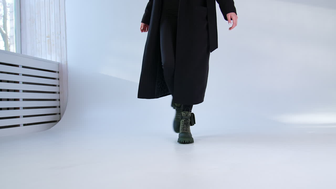 Woman in Black Coat and Green Boots