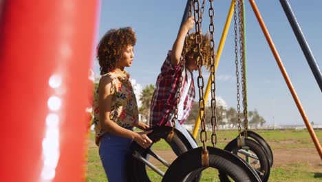 mother and son having fun at playground