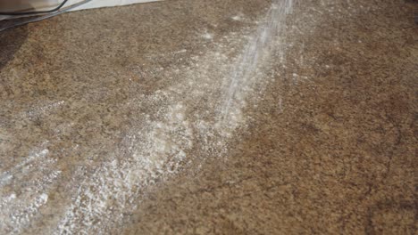 flour thrown across a kitchen surface