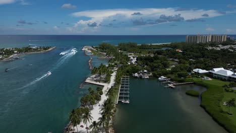 Aerial-Drone-Footage-Over-the-Loxahatchee-River-with-Boats-heading-out-to-Sea