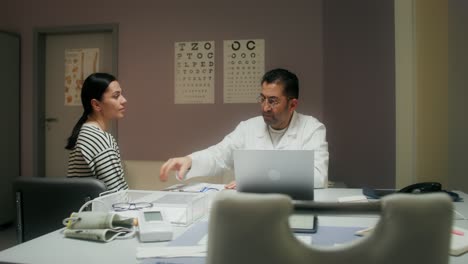 doctor discussing medical images with patient