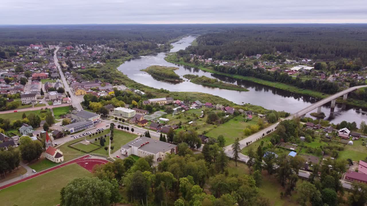 Winding Daugava river, bridge and township of Kraslava, aerial view