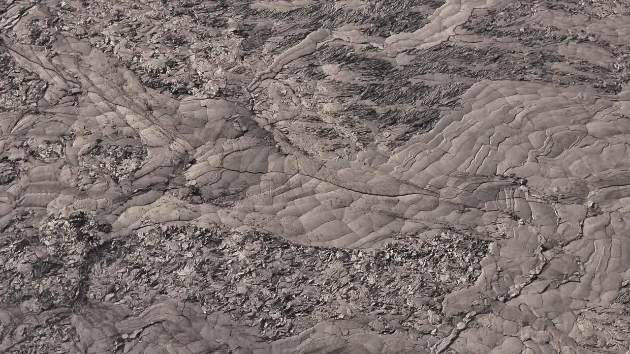 Close-up aerial view of rough volcanic rock texture in Iceland