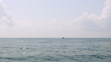 scuba divers on the sea surface of the indian ocean in kenya