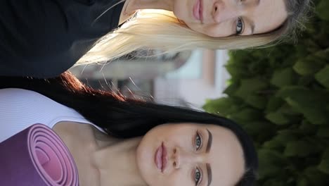 two beautiful sports girls are looking into the camera lens morning fitness training two beautiful sports girls are looking into the camera lens morning fitness training portrait slow motion