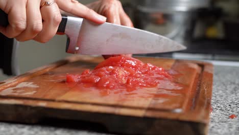 Making-Tomato-Sauce---Chef-Chopping-Tomatoes-On-Wooden-Board