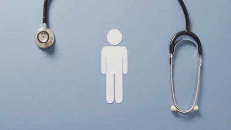 video of close up of stethoscope with people icon on blue background