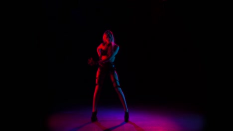 neon dance performance by a woman