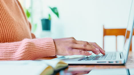 Hands-typing-laptop,-writing-notebook