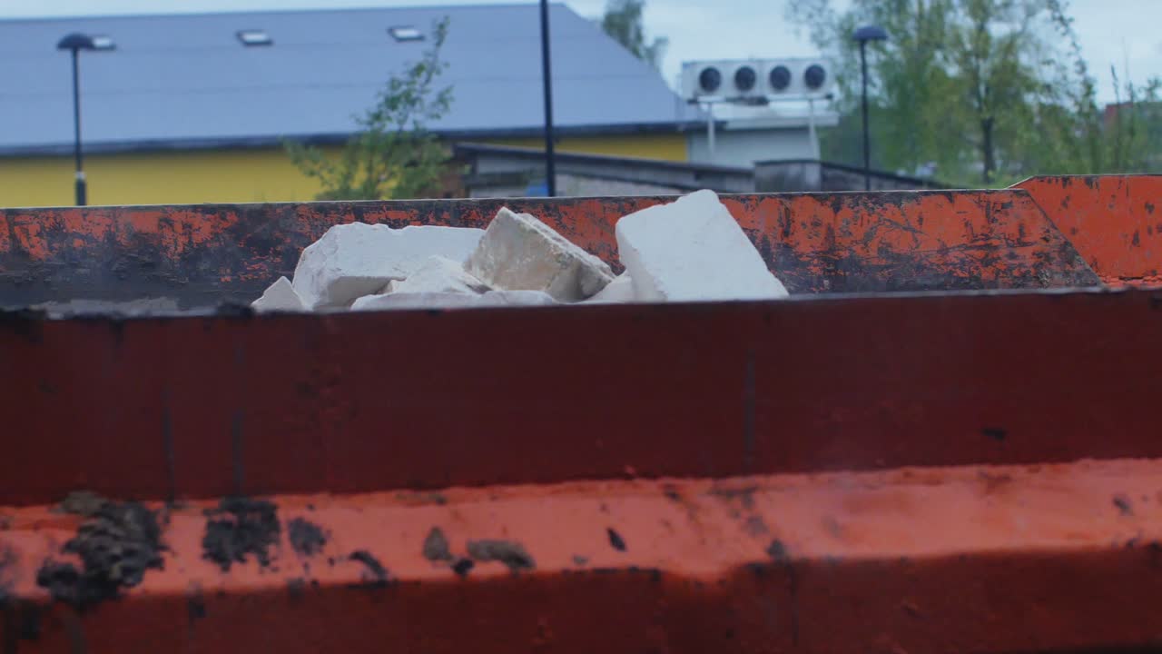 Excavator Loads Construction Silicate Brick Scrap To The Orange Truck