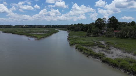 Slow-flight-over-a-marshland-on-a-sunny,-summer-day-in-South-Carolina