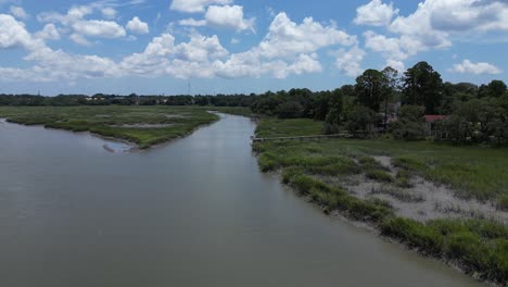 slow flight over a marshland on a sunny, summer day in south carolina