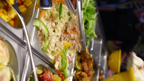 buffet lunch with pasta salad and assorted dishes