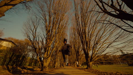 person jumping in a park