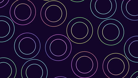 Circular-pattern-of-overlapping-circles-in-shades-of-purple-and-blue-on-a-black-background