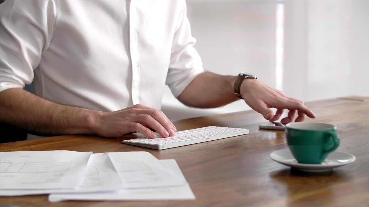 Premium stock video - Busy man working in his office