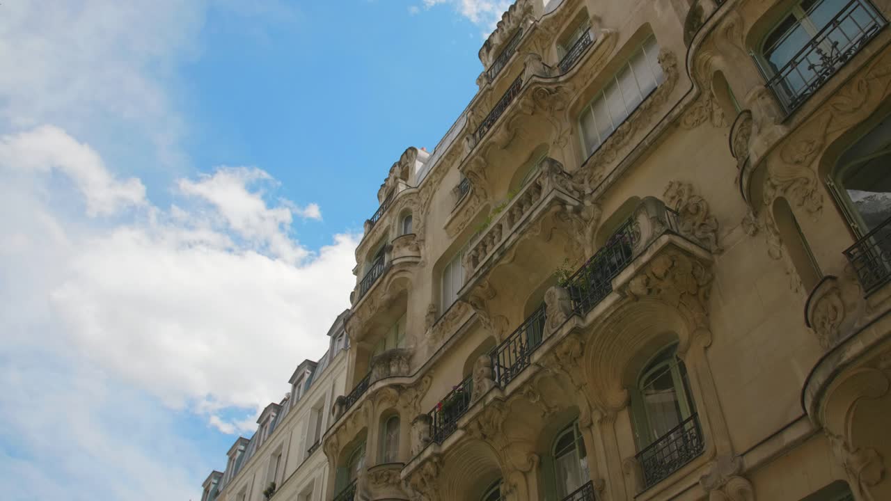 Art Nouveau Exterior Detail Of Les Arums Building In 7th Arrondissement Of Paris In France. Built By Architect Octave Racquin. low angle, slider right