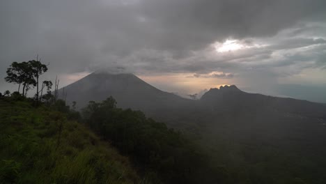 misty mountain vista with a lone figure under a dramatic sky