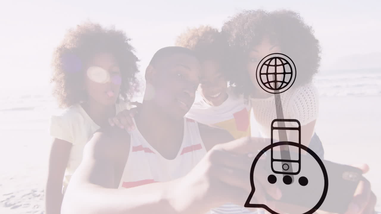 Taking selfie, family at beach with digital communication animation overlay