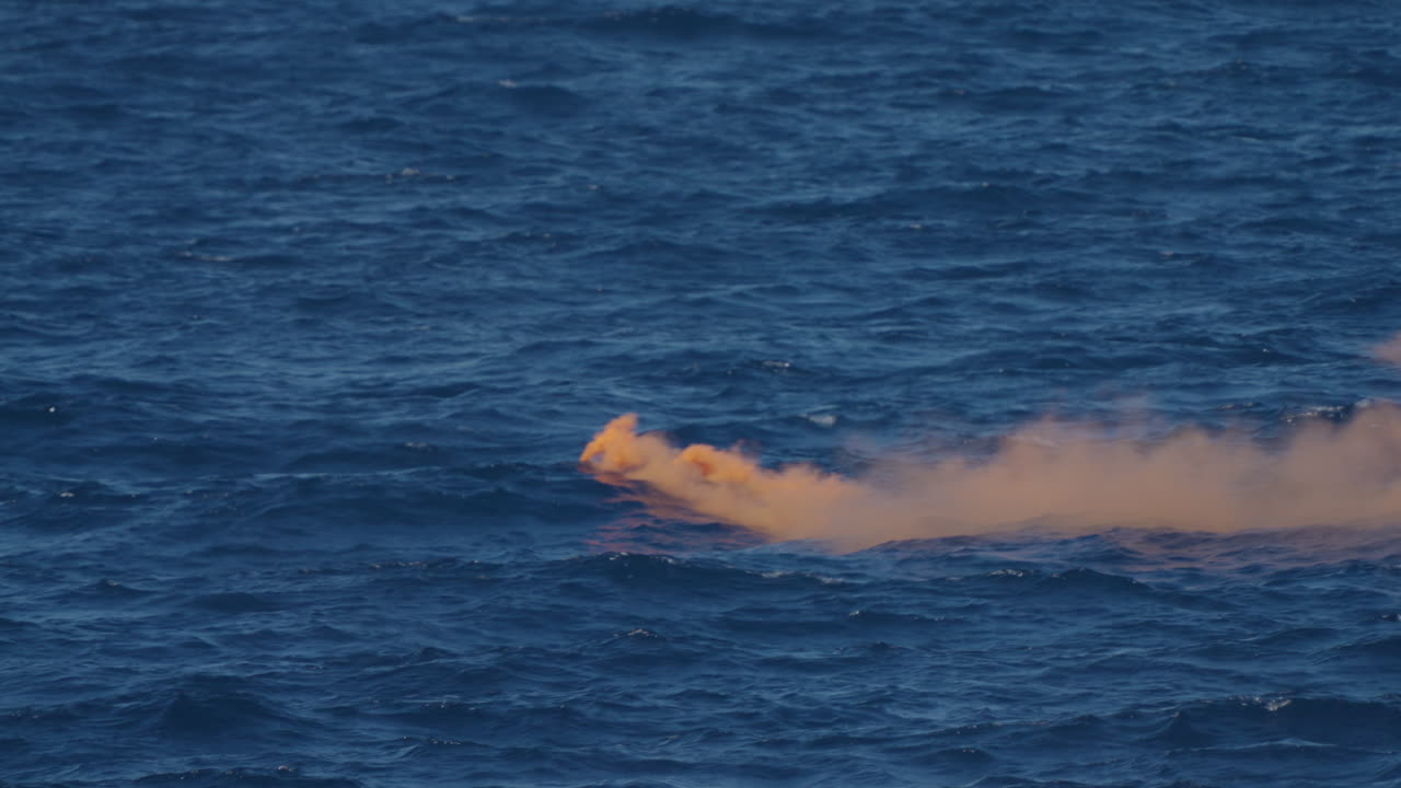 Orange Smoke in the Ocean