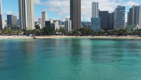 Aerial-view-of-the-Waikiki-beach-with-bathers-and-people-on-the-sea