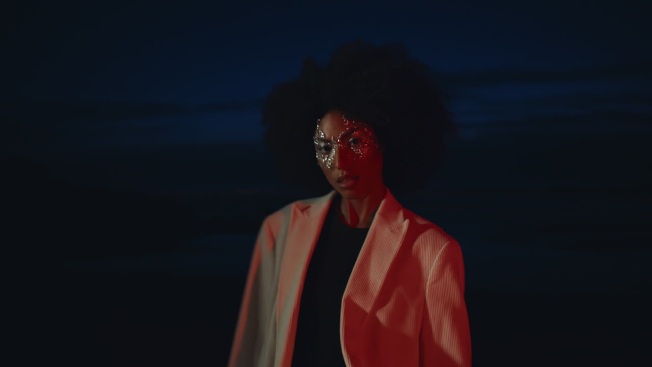 Seductive girl flirting camera at dark shore closeup. Cool fashion model posing