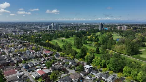 panoramic cityscape and lush greenery between the main and 50th street in oakridge district, vancouver, canada